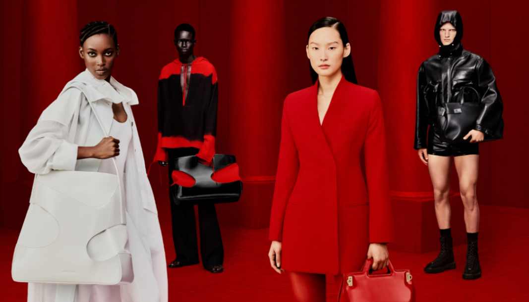 Ferragamo’s February 2023 Spring/Summer campaign featuring models Chol Mabior, Colin Jones, Kai Newman, Mona Tougaard, Silas Lutz, Vittoria Ceretti, and Yoomi Sun. Shot by photographer Rafael Pavarotti with art direction by Edward Quarmby and styling by Mavi Staiano, the models pose against a vivid red backdrop in bold black, red, and white looks. Oversized leather bags, sharp tailoring, and sculptural silhouettes highlight creative director Maximilian Davis’s modern vision for Ferragamo.