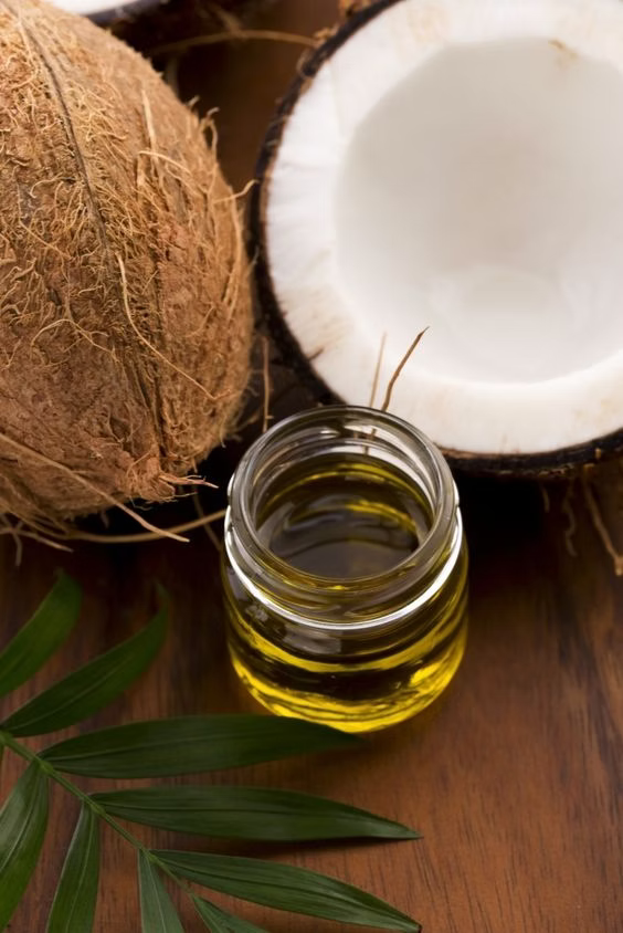 coconut oil in glass container with coconut